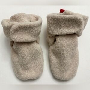 Footwear are fleece baby boy booties.
